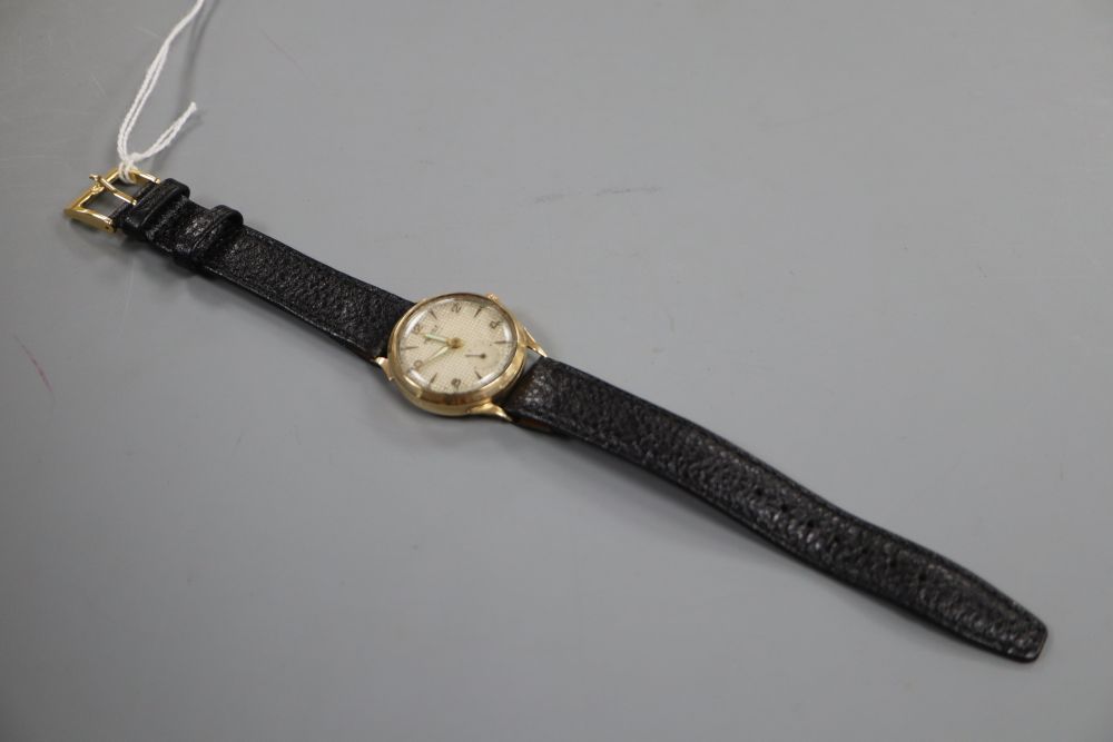 A gentlemans 1950s 9ct gold Majex manual wind wrist watch, on leather strap.